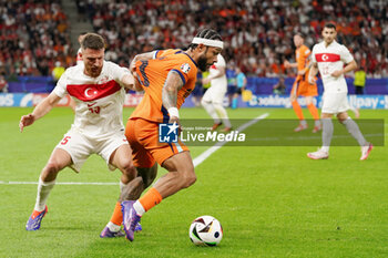 2024-07-06 - Memphis Depay of Netherlands, Salih Ozcan of Turkiye during the UEFA Euro 2024, Quarter-finals football match between Netherlands and Turkiye on July 6, 2024 at Olympiastadion in Berlin, Germany - FOOTBALL - EURO 2024 - 1/4 - NETHERLANDS V TURKIYE - UEFA EUROPEAN - SOCCER