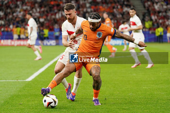 2024-07-06 - Memphis Depay of Netherlands, Salih Ozcan of Turkiye during the UEFA Euro 2024, Quarter-finals football match between Netherlands and Turkiye on July 6, 2024 at Olympiastadion in Berlin, Germany - FOOTBALL - EURO 2024 - 1/4 - NETHERLANDS V TURKIYE - UEFA EUROPEAN - SOCCER