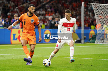 2024-07-06 - Cody Gakpo of Netherlands, Mert Muldur of Turkiye during the UEFA Euro 2024, Quarter-finals football match between Netherlands and Turkiye on July 6, 2024 at Olympiastadion in Berlin, Germany - FOOTBALL - EURO 2024 - 1/4 - NETHERLANDS V TURKIYE - UEFA EUROPEAN - SOCCER