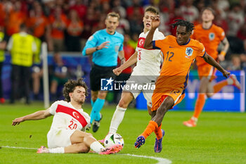 2024-07-06 - Ferdi Kadioglu of Turkiye, Jeremie Frimpong of Netherlands during the UEFA Euro 2024, Quarter-finals football match between Netherlands and Turkiye on July 6, 2024 at Olympiastadion in Berlin, Germany - FOOTBALL - EURO 2024 - 1/4 - NETHERLANDS V TURKIYE - UEFA EUROPEAN - SOCCER