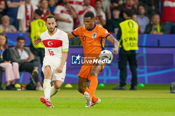 2024-07-06 - Hakan Calhanoglu of Turkiye, Denzel Dumfries of Netherlands during the UEFA Euro 2024, Quarter-finals football match between Netherlands and Turkiye on July 6, 2024 at Olympiastadion in Berlin, Germany - FOOTBALL - EURO 2024 - 1/4 - NETHERLANDS V TURKIYE - UEFA EUROPEAN - SOCCER