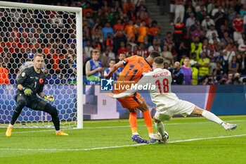 2024-07-06 - Mert Muldur of Turkiye scores an own goal 2-1, Goalkeeper Mert Gunok of Turkiye, Cody Gakpo of Netherlands during the UEFA Euro 2024, Quarter-finals football match between Netherlands and Turkiye on July 6, 2024 at Olympiastadion in Berlin, Germany - FOOTBALL - EURO 2024 - 1/4 - NETHERLANDS V TURKIYE - UEFA EUROPEAN - SOCCER