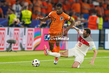 2024-07-06 - Denzel Dumfries of Netherlands, Hakan Calhanoglu of Turkiye during the UEFA Euro 2024, Quarter-finals football match between Netherlands and Turkiye on July 6, 2024 at Olympiastadion in Berlin, Germany - FOOTBALL - EURO 2024 - 1/4 - NETHERLANDS V TURKIYE - UEFA EUROPEAN - SOCCER