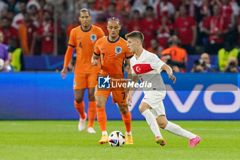 2024-07-06 - Xavi Simons of Netherlands, Arda Guler of Turkiye during the UEFA Euro 2024, Quarter-finals football match between Netherlands and Turkiye on July 6, 2024 at Olympiastadion in Berlin, Germany - FOOTBALL - EURO 2024 - 1/4 - NETHERLANDS V TURKIYE - UEFA EUROPEAN - SOCCER