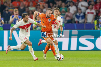 2024-07-06 - Hakan Calhanoglu of Turkiye, Stefan De Vrij of Netherlands during the UEFA Euro 2024, Quarter-finals football match between Netherlands and Turkiye on July 6, 2024 at Olympiastadion in Berlin, Germany - FOOTBALL - EURO 2024 - 1/4 - NETHERLANDS V TURKIYE - UEFA EUROPEAN - SOCCER