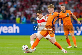 2024-07-06 - Kenan Yildiz of Turkiye, Jerdy Schouten of Netherlands during the UEFA Euro 2024, Quarter-finals football match between Netherlands and Turkiye on July 6, 2024 at Olympiastadion in Berlin, Germany - FOOTBALL - EURO 2024 - 1/4 - NETHERLANDS V TURKIYE - UEFA EUROPEAN - SOCCER