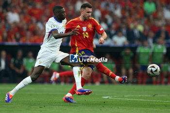 2024-07-09 - Munich , Germany 09.07.2024: Randal Kolo Muani of France, Aymeric Laporte of Spain during the UEFA EURO 2024 semi-finals, football match between Spain vs France at Munich Football Allianz Arena - UEFA EURO 2024 - SEMIFINALS - SPAIN VS FRANCE  - UEFA EUROPEAN - SOCCER