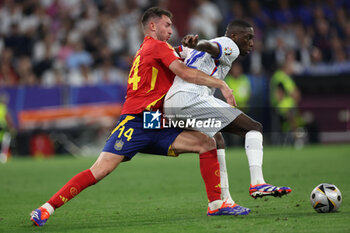 2024-07-09 - Munich , Germany 09.07.2024: Aymeric Laporte of Spain, Randal Kolo Muani of France during the UEFA EURO 2024 semi-finals, football match between Spain vs France at Munich Football Allianz Arena - UEFA EURO 2024 - SEMIFINALS - SPAIN VS FRANCE  - UEFA EUROPEAN - SOCCER