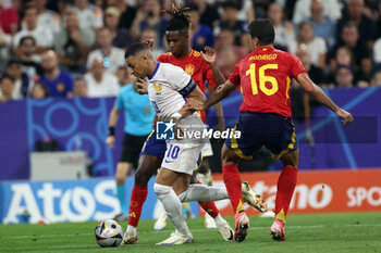 2024-07-09 - Munich , Germany 09.07.2024: Kylian Mbappe of France Rodri of Spain during the UEFA EURO 2024 semi-finals, football match between Spain vs France at Munich Football Allianz Arena - UEFA EURO 2024 - SEMIFINALS - SPAIN VS FRANCE  - UEFA EUROPEAN - SOCCER