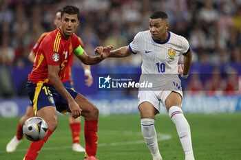 2024-07-09 - Munich , Germany 09.07.2024: Rodri of Spain, Kylian Mbappe of France during the UEFA EURO 2024 semi-finals, football match between Spain vs France at Munich Football Allianz Arena - UEFA EURO 2024 - SEMIFINALS - SPAIN VS FRANCE  - UEFA EUROPEAN - SOCCER