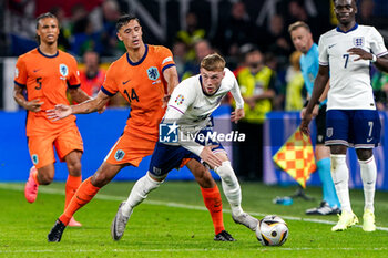 2024-07-10 - Tijjani Reijnders of the Netherlands battles for possession with Cole Palmer of England during the UEFA Euro 2024, Semi-finals football match between Netherlands and England on 10 July 2024 at Signal Iduna Park in Dortmund, Germany - FOOTBALL - EURO 2024 - 1/2 - NETHERLANDS V ENGLAND - UEFA EUROPEAN - SOCCER