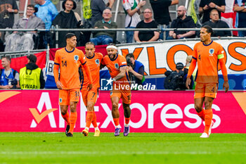 2024-07-10 - Xavi Simons of the Netherlands celebrates his goal 1-0 with Memphis Depay during the UEFA Euro 2024, Semi-finals football match between Netherlands and England on 10 July 2024 at Signal Iduna Park in Dortmund, Germany - FOOTBALL - EURO 2024 - 1/2 - NETHERLANDS V ENGLAND - UEFA EUROPEAN - SOCCER