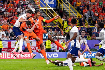 2024-07-10 - John Stones of England and Wout Weghorst, Virgil van Dijk of the Netherlands during the UEFA Euro 2024, Semi-finals football match between Netherlands and England on 10 July 2024 at Signal Iduna Park in Dortmund, Germany - FOOTBALL - EURO 2024 - 1/2 - NETHERLANDS V ENGLAND - UEFA EUROPEAN - SOCCER