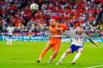 2024-07-10 - Donyell Malen of the Netherlands battles for possession with Kieran Trippier of England during the UEFA Euro 2024, Semi-finals football match between Netherlands and England on 10 July 2024 at Signal Iduna Park in Dortmund, Germany - FOOTBALL - EURO 2024 - 1/2 - NETHERLANDS V ENGLAND - UEFA EUROPEAN - SOCCER