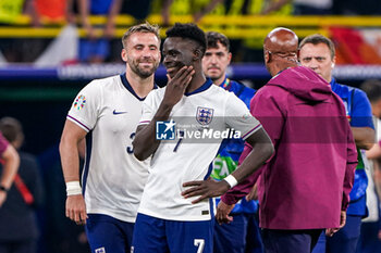 2024-07-10 - Luke Shaw, Bukayo Saka of England celebrate after the UEFA Euro 2024, Semi-finals football match between Netherlands and England on 10 July 2024 at Signal Iduna Park in Dortmund, Germany - FOOTBALL - EURO 2024 - 1/2 - NETHERLANDS V ENGLAND - UEFA EUROPEAN - SOCCER