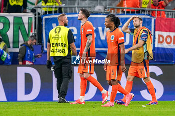 2024-07-10 - Wout Weghorst, Nathan Ake, Daley Blind of the Netherlands look dejected after the UEFA Euro 2024, Semi-finals football match between Netherlands and England on 10 July 2024 at Signal Iduna Park in Dortmund, Germany - FOOTBALL - EURO 2024 - 1/2 - NETHERLANDS V ENGLAND - UEFA EUROPEAN - SOCCER