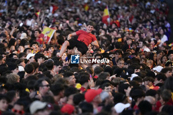 2024-07-15 - A Spanish fan seen throwning into the air during the celebration of the Spanish national football team for the victory of the UEFA Euro 2024 title at Plaza de Cibeles on May 12, 2024 in Madrid, Spain. - SPAIN CELEBRATION UEFA EURO 2024 WIN - UEFA EUROPEAN - SOCCER