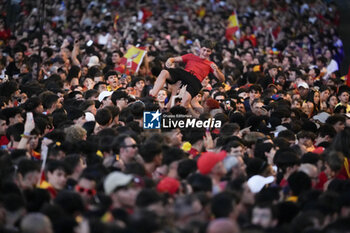 2024-07-15 - A Spanish fan seen throwning into the air during the celebration of the Spanish national football team for the victory of the UEFA Euro 2024 title at Plaza de Cibeles on May 12, 2024 in Madrid, Spain. - SPAIN CELEBRATION UEFA EURO 2024 WIN - UEFA EUROPEAN - SOCCER