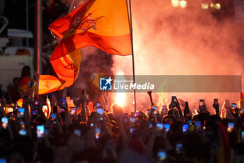 2024-07-15 - Spanish fans light a smoke bomb during the celebration of the Spanish national football team for the victory of the UEFA Euro 2024 title at Plaza de Cibeles on May 12, 2024 in Madrid, Spain. - SPAIN CELEBRATION UEFA EURO 2024 WIN - UEFA EUROPEAN - SOCCER