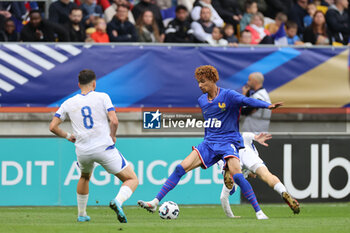 2024-09-10 - Eldar Mehmedovic (BOS), Hugo Etikite (FRA) during the UEFA Under 21 Championship 2025, Qualifying, Group H football match between France and Bosnia and Herzegovina on 10 September 2024 at MMArena in Le Mans, France - FOOTBALL - UEFA U21 EURO 2025 - QUALIFYING - FRANCE V BOSNIA AND HERZEGOVINA - UEFA EUROPEAN - SOCCER