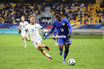 2024-09-10 - Nail Omerovic (BOS), Dilane Bakwa (FRA) during the UEFA Under 21 Championship 2025, Qualifying, Group H football match between France and Bosnia and Herzegovina on 10 September 2024 at MMArena in Le Mans, France - FOOTBALL - UEFA U21 EURO 2025 - QUALIFYING - FRANCE V BOSNIA AND HERZEGOVINA - UEFA EUROPEAN - SOCCER