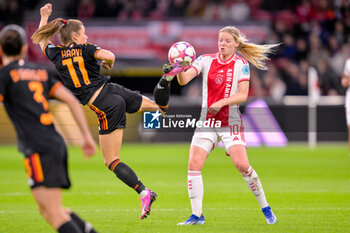 2024-01-30 - Emilie Haavi of AS Roma kicks the ball, Nadine Noordam of AFC Ajax during the UEFA Women's Champions League, Group C football match between AFC Ajax and AS Roma on January 30, 2024 at Sportpark De Toekomst in Amsterdam-Duivendrecht, Netherlands - FOOTBALL - WOMEN'S CHAMPIONS LEAGUE - AJAX V AS ROMA - UEFA CHAMPIONS LEAGUE WOMEN - SOCCER