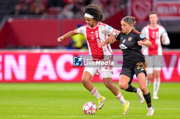 2024-01-30 - Lily Yohannes of AFC Ajax battles for possession with Laura Feiersinger of AS Roma during the UEFA Women's Champions League, Group C football match between AFC Ajax and AS Roma on January 30, 2024 at Sportpark De Toekomst in Amsterdam-Duivendrecht, Netherlands - FOOTBALL - WOMEN'S CHAMPIONS LEAGUE - AJAX V AS ROMA - UEFA CHAMPIONS LEAGUE WOMEN - SOCCER