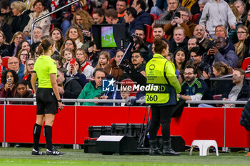 2024-03-19 - Referee Maria Caputi watches the VAR screen during the UEFA Women's Champions League, Quarter-finals, 1st leg football match between AFC Ajax and Chelsea FC on March 19, 2024 at Johan Cruijff ArenA in Amsterdam, Netherlands - FOOTBALL - WOMEN'S CHAMPIONS LEAGUE - AJAX V CHELSEA - UEFA CHAMPIONS LEAGUE WOMEN - SOCCER