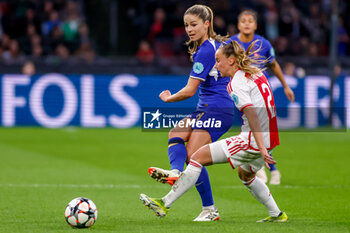 2024-03-19 - Melanie Leupolz of Chelsea is challenged by Rosa van Gool of AFC Ajax during the UEFA Women's Champions League, Quarter-finals, 1st leg football match between AFC Ajax and Chelsea FC on March 19, 2024 at Johan Cruijff ArenA in Amsterdam, Netherlands - FOOTBALL - WOMEN'S CHAMPIONS LEAGUE - AJAX V CHELSEA - UEFA CHAMPIONS LEAGUE WOMEN - SOCCER