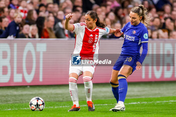 2024-03-19 - Daliyah de Klonia of AFC Ajax is challenged by Johanna Rytting Kaneryd of Chelsea during the UEFA Women's Champions League, Quarter-finals, 1st leg football match between AFC Ajax and Chelsea FC on March 19, 2024 at Johan Cruijff ArenA in Amsterdam, Netherlands - FOOTBALL - WOMEN'S CHAMPIONS LEAGUE - AJAX V CHELSEA - UEFA CHAMPIONS LEAGUE WOMEN - SOCCER