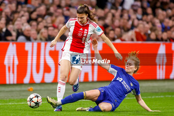 2024-03-19 - Danique Noordman of AFC Ajax is challenged by Melanie Leupolz of Chelsea during the UEFA Women's Champions League, Quarter-finals, 1st leg football match between AFC Ajax and Chelsea FC on March 19, 2024 at Johan Cruijff ArenA in Amsterdam, Netherlands - FOOTBALL - WOMEN'S CHAMPIONS LEAGUE - AJAX V CHELSEA - UEFA CHAMPIONS LEAGUE WOMEN - SOCCER