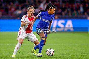 2024-03-19 - Ashley Lawrence of Chelsea is challenged by Chasity Grant of AFC Ajax during the UEFA Women's Champions League, Quarter-finals, 1st leg football match between AFC Ajax and Chelsea FC on March 19, 2024 at Johan Cruijff ArenA in Amsterdam, Netherlands - FOOTBALL - WOMEN'S CHAMPIONS LEAGUE - AJAX V CHELSEA - UEFA CHAMPIONS LEAGUE WOMEN - SOCCER