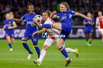 2024-03-19 - Guro Reiten of Chelsea is challenged by Chasity Grant of AFC Ajax during the UEFA Women's Champions League, Quarter-finals, 1st leg football match between AFC Ajax and Chelsea FC on March 19, 2024 at Johan Cruijff ArenA in Amsterdam, Netherlands - FOOTBALL - WOMEN'S CHAMPIONS LEAGUE - AJAX V CHELSEA - UEFA CHAMPIONS LEAGUE WOMEN - SOCCER