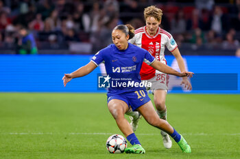 2024-03-19 - Lauren James of Chelsea is challenged by Isa Kardinaal of AFC Ajax during the UEFA Women's Champions League, Quarter-finals, 1st leg football match between AFC Ajax and Chelsea FC on March 19, 2024 at Johan Cruijff ArenA in Amsterdam, Netherlands - FOOTBALL - WOMEN'S CHAMPIONS LEAGUE - AJAX V CHELSEA - UEFA CHAMPIONS LEAGUE WOMEN - SOCCER