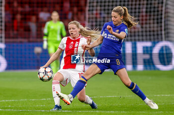 2024-03-19 - Nadine Noordam of AFC Ajax battles for the ball with Melanie Leupolz of Chelsea during the UEFA Women's Champions League, Quarter-finals, 1st leg football match between AFC Ajax and Chelsea FC on March 19, 2024 at Johan Cruijff ArenA in Amsterdam, Netherlands - FOOTBALL - WOMEN'S CHAMPIONS LEAGUE - AJAX V CHELSEA - UEFA CHAMPIONS LEAGUE WOMEN - SOCCER