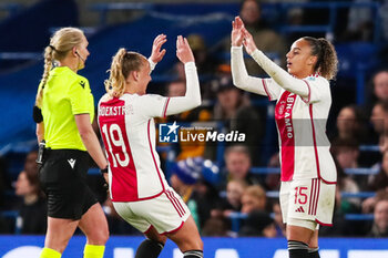 2024-03-27 - Ajax’s Chasity Grant celebrates her goal 1-1 with Tiny Hoekstra during the UEFA Women's Champions League, Quarter-finals, 2nd leg football match between Chelsea FC and AFC Ajax on 27 March 2024 at Stamford Bridge in London, England - FOOTBALL - WOMEN'S CHAMPIONS LEAGUE - CHELSEA V AJAX - UEFA CHAMPIONS LEAGUE WOMEN - SOCCER