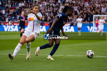 2024-04-28 - Delphine Cascarino of Olympique Lyonnais and Thiniba Samoura of Paris Saint Germain fight for the ball during the UEFA Women's Champions League, Semi-finals, 2nd leg football match between Paris Saint-Germain and Olympique Lyonnais on April 28, 2024 at Parc des Princes stadium in Paris, France - FOOTBALL - WOMEN'S CHAMPIONS LEAGUE - PARIS SG V LYON - UEFA CHAMPIONS LEAGUE WOMEN - SOCCER
