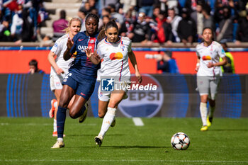 2024-04-28 - Thiniba Samoura of Paris Saint Germain and Delphine Cascarino of Olympique Lyonnais fight for the ball during the UEFA Women's Champions League, Semi-finals, 2nd leg football match between Paris Saint-Germain and Olympique Lyonnais on April 28, 2024 at Parc des Princes stadium in Paris, France - FOOTBALL - WOMEN'S CHAMPIONS LEAGUE - PARIS SG V LYON - UEFA CHAMPIONS LEAGUE WOMEN - SOCCER