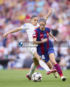 2024-05-25 - Delphine Cascarino of Olympique Lyonnais competes for the ball with Aitana Bonmati of FC Barcelona during the UEFA Women's Champions League, Final, football match between FC Barcelona and Olympique Lyonnais on May 25, 2024 at San Mames stadium in Bilbao, Spain - FOOTBALL - WOMEN'S CHAMPIONS LEAGUE - FINAL - FC BARCELONA V LYON - UEFA CHAMPIONS LEAGUE WOMEN - SOCCER