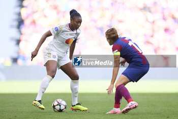 2024-05-25 - Kadidiatou Diani of Olympique Lyonnais competes for the ball with Patri Guijarro of FC Barcelona during the UEFA Women's Champions League, Final, football match between FC Barcelona and Olympique Lyonnais on May 25, 2024 at San Mames stadium in Bilbao, Spain - FOOTBALL - WOMEN'S CHAMPIONS LEAGUE - FINAL - FC BARCELONA V LYON - UEFA CHAMPIONS LEAGUE WOMEN - SOCCER