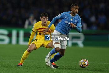 2024-02-21 - Barcellona's Danish defender Andreas Christensen challenges for the ball with SSC Napoli's Swedish midfielder Jens-Lys Michel Cajuste during the UEFA Champions League round 16 match between SSC Napoli vs Barcellona at the Diego Armando Maradona Stadium in Naples, southern Italy, on February 21, 2024. - SSC NAPOLI VS FC BARCELONA - UEFA CHAMPIONS LEAGUE - SOCCER