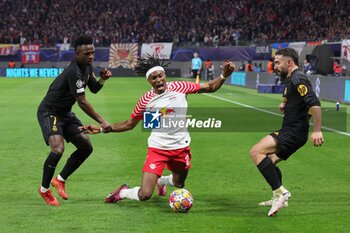 2024-02-13 - Mohamed Simakan of RB Leipzig and Vinicius Junior, Dani Carvajal of Real Madrid during the UEFA Champions League, Round of 16 1st leg football match between Red Bull Leipzig and Real Madrid on February 13, 2024 at Red Bull Arena in Leipzig, Germany - FOOTBALL - CHAMPIONS LEAGUE - RB LEIPZIG V REAL MADRID - UEFA CHAMPIONS LEAGUE - SOCCER