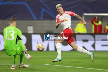 2024-02-13 - Benjamin Sesko of RB Leipzig and Andriy Lunin of Real Madrid during the UEFA Champions League, Round of 16 1st leg football match between Red Bull Leipzig and Real Madrid on February 13, 2024 at Red Bull Arena in Leipzig, Germany - FOOTBALL - CHAMPIONS LEAGUE - RB LEIPZIG V REAL MADRID - UEFA CHAMPIONS LEAGUE - SOCCER