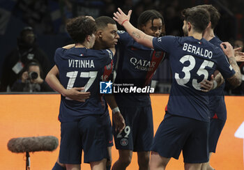 2024-02-14 - Kylian Mbappe of PSG celebrates his goal with Bradley Barcola and teammates during the UEFA Champions League, Round of 16 1st leg football match between Paris Saint-Germain (PSG) and Real Sociedad on February 14, 2024 at Parc des Princes stadium in Paris, France - FOOTBALL - CHAMPIONS LEAGUE - PARIS SG V REAL SOCIEDAD - UEFA CHAMPIONS LEAGUE - SOCCER