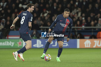 2024-02-14 - Kylian Mbappe, left Fabian Ruiz Pena of PSG during the UEFA Champions League, Round of 16 1st leg football match between Paris Saint-Germain (PSG) and Real Sociedad on February 14, 2024 at Parc des Princes stadium in Paris, France - FOOTBALL - CHAMPIONS LEAGUE - PARIS SG V REAL SOCIEDAD - UEFA CHAMPIONS LEAGUE - SOCCER
