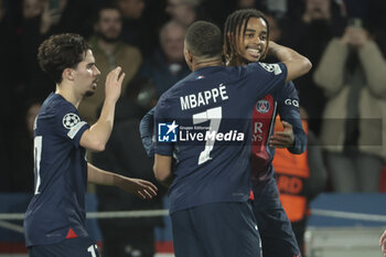 2024-02-14 - Bradley Barcola of PSG celebrates his goal with Kylian Mbappe, left Vitinha during the UEFA Champions League, Round of 16 1st leg football match between Paris Saint-Germain (PSG) and Real Sociedad on February 14, 2024 at Parc des Princes stadium in Paris, France - FOOTBALL - CHAMPIONS LEAGUE - PARIS SG V REAL SOCIEDAD - UEFA CHAMPIONS LEAGUE - SOCCER