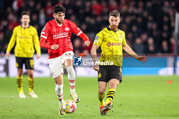 2024-02-20 - Ricardo Pepi of PSV, Salih Ozcan of Borussia Dortmund during the UEFA Champions League, Round of 16 1st leg football match between PSV and Borussia Dortmund on February 20, 2024 at Philips Stadion in Eindhoven, Netherlands - FOOTBALL - CHAMPIONS LEAGUE - PSV V DORTMUND - UEFA CHAMPIONS LEAGUE - SOCCER