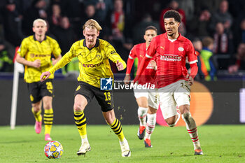 2024-02-20 - Julian Brandt of Borussia Dortmund, Malik Tillman of PSV during the UEFA Champions League, Round of 16 1st leg football match between PSV and Borussia Dortmund on February 20, 2024 at Philips Stadion in Eindhoven, Netherlands - FOOTBALL - CHAMPIONS LEAGUE - PSV V DORTMUND - UEFA CHAMPIONS LEAGUE - SOCCER