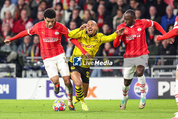 2024-02-20 - Malik Tillman of PSV, Donyell Malen of Borussia Dortmund, Jordan Teze of PSV during the UEFA Champions League, Round of 16 1st leg football match between PSV and Borussia Dortmund on February 20, 2024 at Philips Stadion in Eindhoven, Netherlands - FOOTBALL - CHAMPIONS LEAGUE - PSV V DORTMUND - UEFA CHAMPIONS LEAGUE - SOCCER