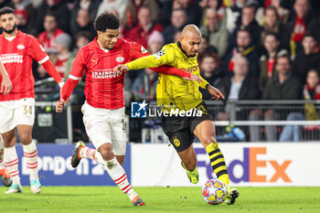 2024-02-20 - Malik Tillman of PSV, Donyell Malen of Borussia Dortmund during the UEFA Champions League, Round of 16 1st leg football match between PSV and Borussia Dortmund on February 20, 2024 at Philips Stadion in Eindhoven, Netherlands - FOOTBALL - CHAMPIONS LEAGUE - PSV V DORTMUND - UEFA CHAMPIONS LEAGUE - SOCCER
